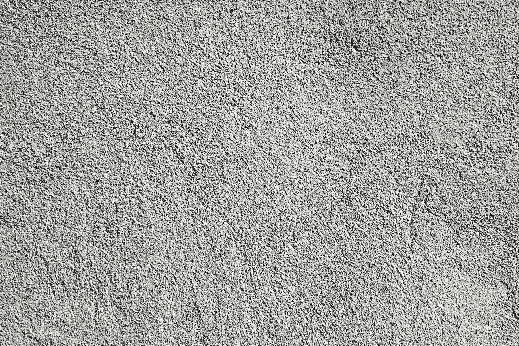Textured cement render wall surface