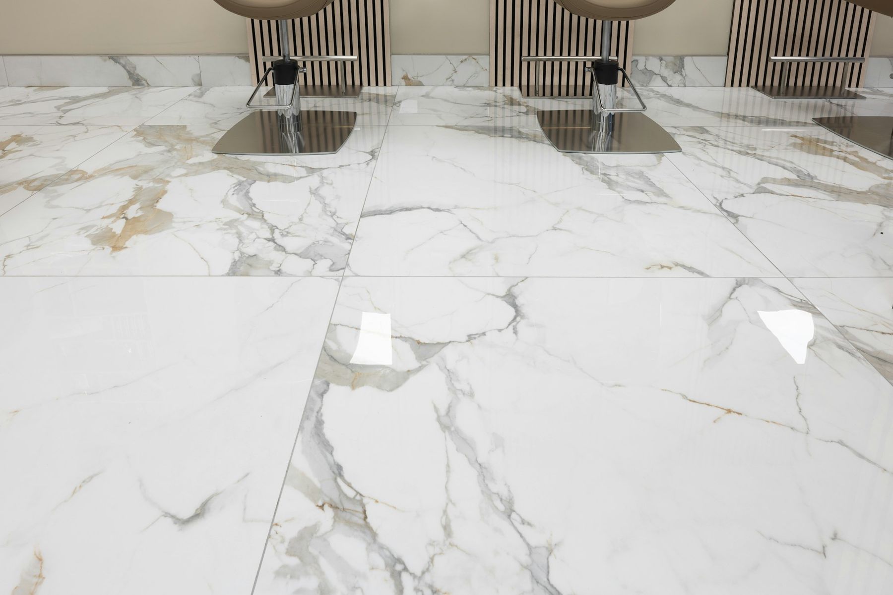 Large-format marble-look porcelain tiles laid across a floor